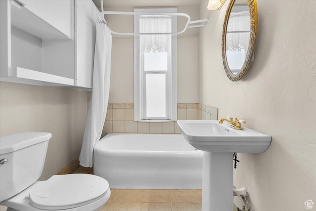 114 E Main St, Moroni, UT 84646 - full bath featuring shower / tub combo and tile patterned floors