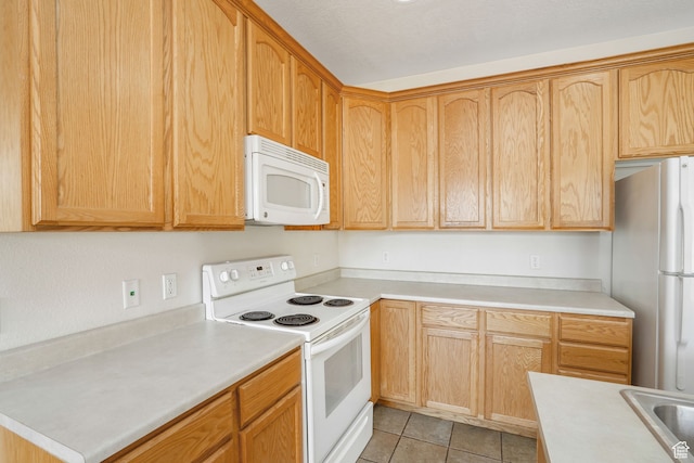 6882 W Bamburgh Way W, West Valley City, UT 84128 - kitchen with white appliances, a textured ceiling, and light tile patterned floors