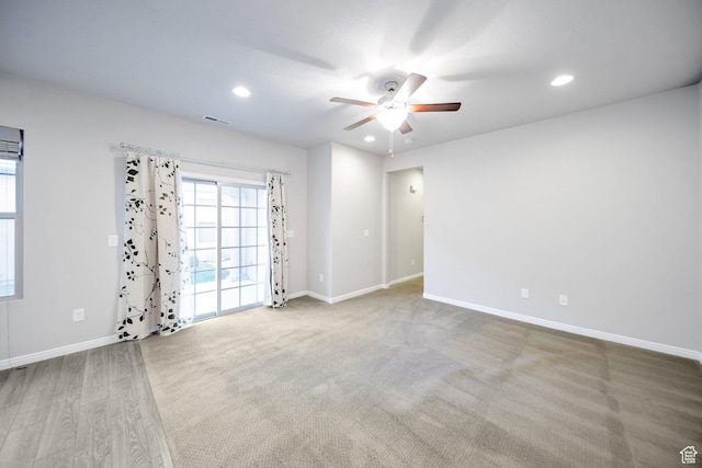 unfurnished room with ceiling fan, baseboards, visible vents, and recessed lighting
