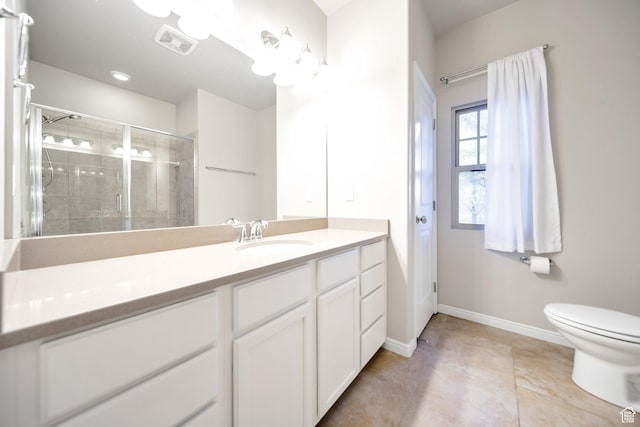 bathroom with toilet, a tile shower, visible vents, baseboards, and vanity