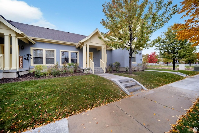 ranch-style home with a front lawn and stucco siding