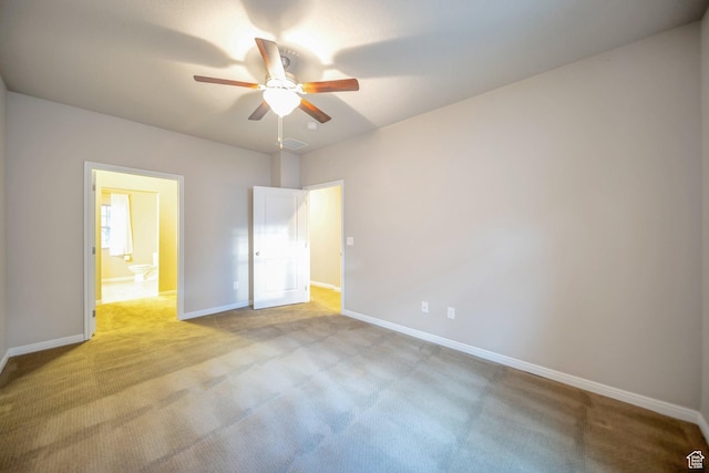 unfurnished bedroom featuring baseboards, ceiling fan, light carpet, and visible vents