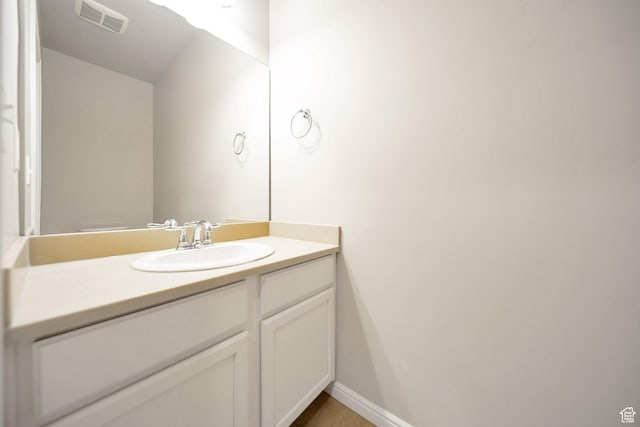 bathroom featuring visible vents and vanity