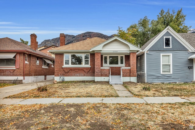 bungalow-style home with a mountain view