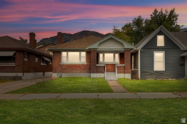 view of front of home with a yard