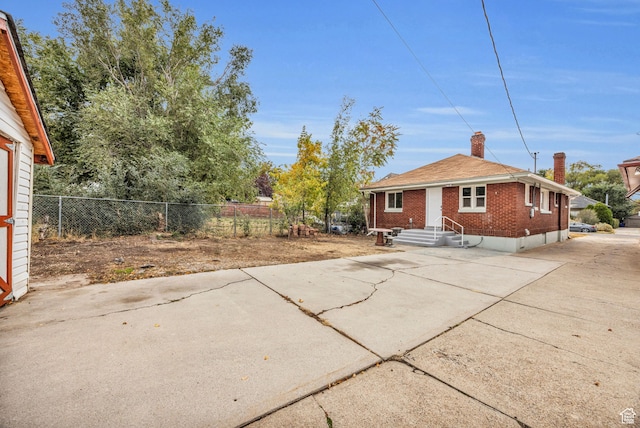 view of property exterior with a patio