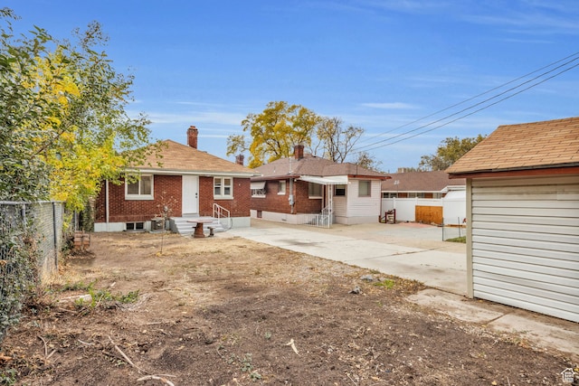 back of house with a patio area