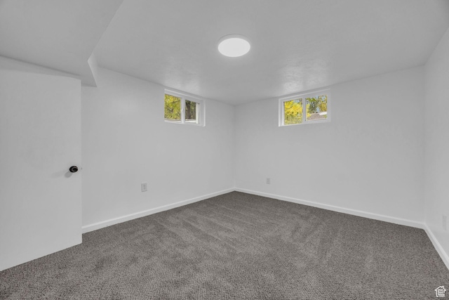 2358 Van Buren Ave, Ogden, UT 84401 - basement featuring dark carpet, baseboards, and healthy amount of natural light