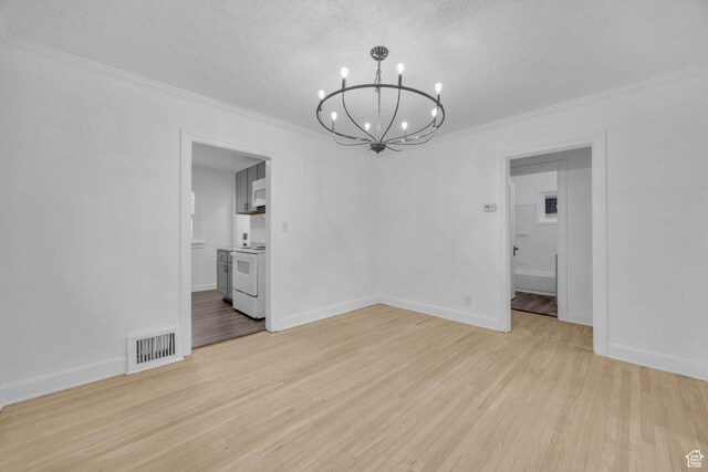 2358 Van Buren Ave, Ogden, UT 84401 - empty room featuring a chandelier, ornamental molding, light wood-type flooring, baseboards, and a textured ceiling