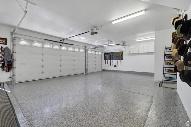 301 S Rachel Ln, New Harmony, UT 84757 - garage featuring a garage door opener and baseboards