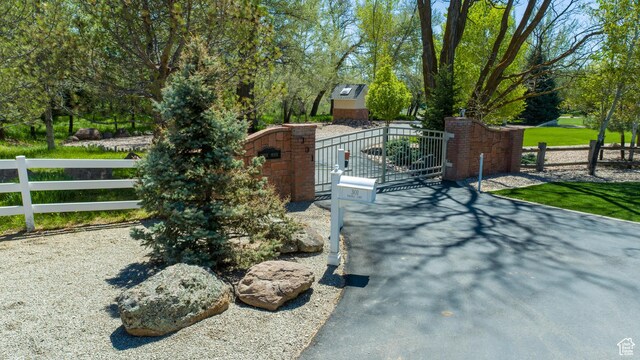301 S Rachel Ln, New Harmony, UT 84757 - view of asphalt driveway featuring a gate and a gated entry