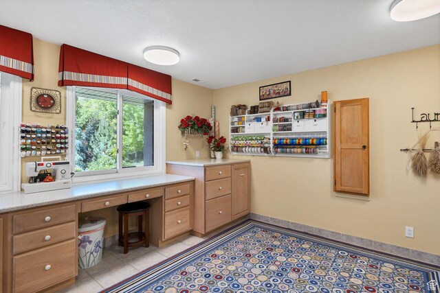 301 S Rachel Ln, New Harmony, UT 84757 - office space with built in study area and light tile patterned floors
