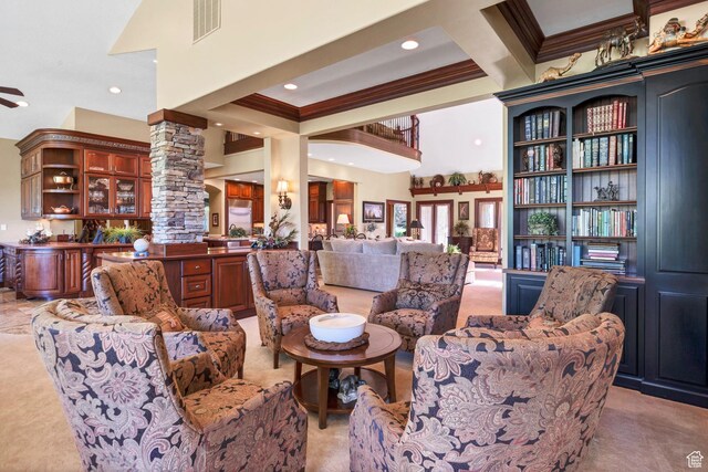 301 S Rachel Ln, New Harmony, UT 84757 - living area with decorative columns, crown molding, light colored carpet, a high ceiling, and beam ceiling