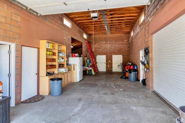 301 S Rachel Ln, New Harmony, UT 84757 - garage with a garage door opener and freestanding refrigerator