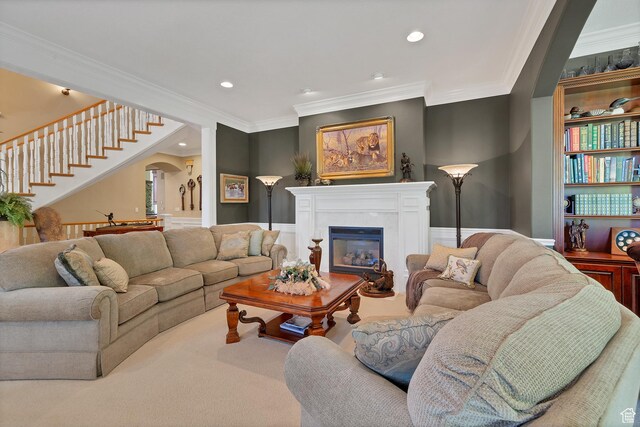 301 S Rachel Ln, New Harmony, UT 84757 - living area featuring ornamental molding, arched walkways, a fireplace, stairway, and recessed lighting