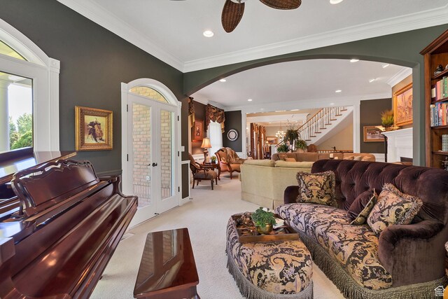 301 S Rachel Ln, New Harmony, UT 84757 - living room featuring arched walkways, light carpet, crown molding, recessed lighting, and stairs