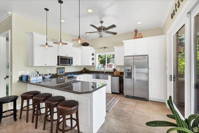 301 S Rachel Ln, New Harmony, UT 84757 - kitchen with stainless steel appliances, a sink, a peninsula, white cabinets, and recessed lighting