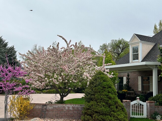 301 S Rachel Ln, New Harmony, UT 84757 - view of property exterior with a shingled roof and brick siding