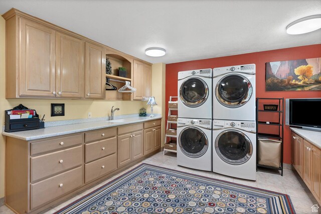 301 S Rachel Ln, New Harmony, UT 84757 - laundry room with separate washer and dryer, estacked washer and dryer, cabinet space, and light tile patterned floors