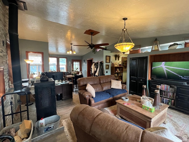 295 N 200 W, Monroe, UT 84754 - living room featuring a wood stove, a textured ceiling, and ceiling fan