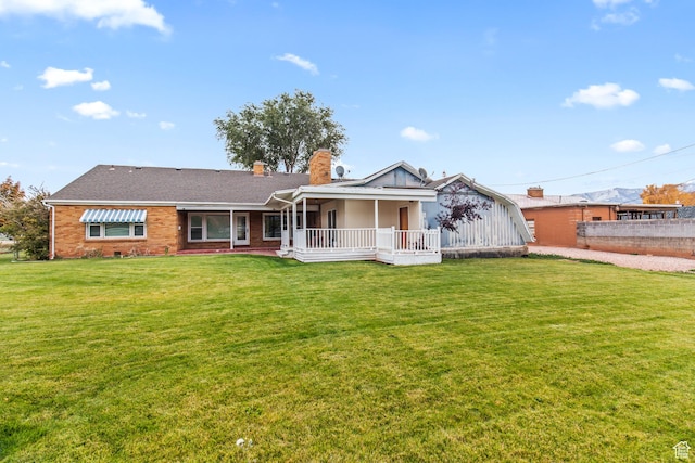 455 N 500 W, Richfield, UT 84701 - view of front of property featuring a chimney, a front yard, a porch, and brick siding