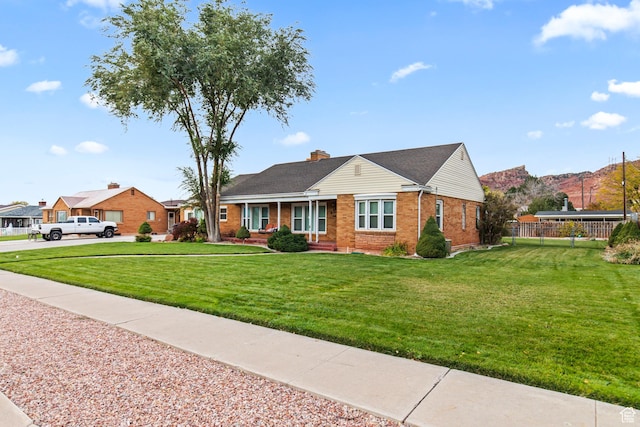 455 N 500 W, Richfield, UT 84701 - ranch-style home with brick siding, a chimney, and covered porch