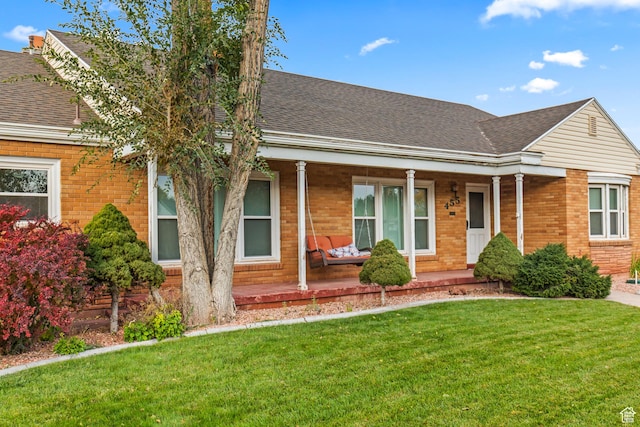455 N 500 W, Richfield, UT 84701 - view of front of property featuring covered porch, brick siding, and roof with shingles