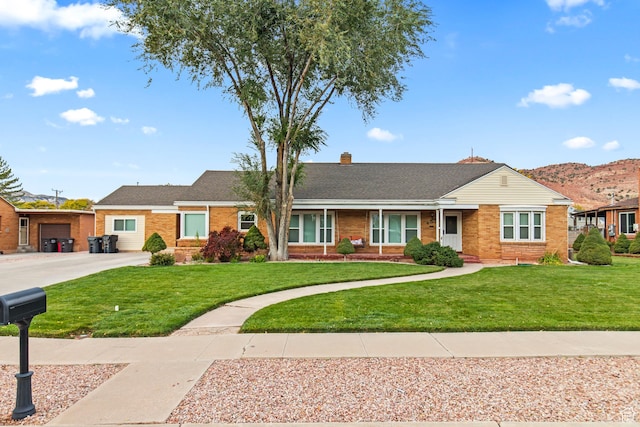 455 N 500 W, Richfield, UT 84701 - single story home featuring brick siding, a front yard, driveway, and a chimney