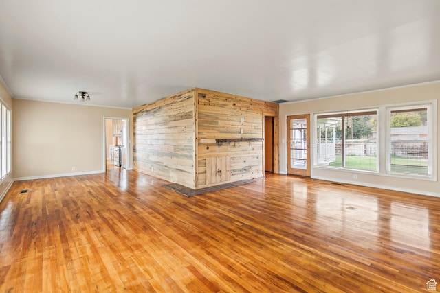 455 N 500 W, Richfield, UT 84701 - unfurnished living room featuring wood finished floors, crown molding, and baseboards