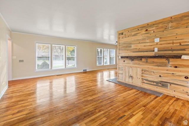 455 N 500 W, Richfield, UT 84701 - unfurnished living room with wood finished floors, ornamental molding, baseboards, and wood walls
