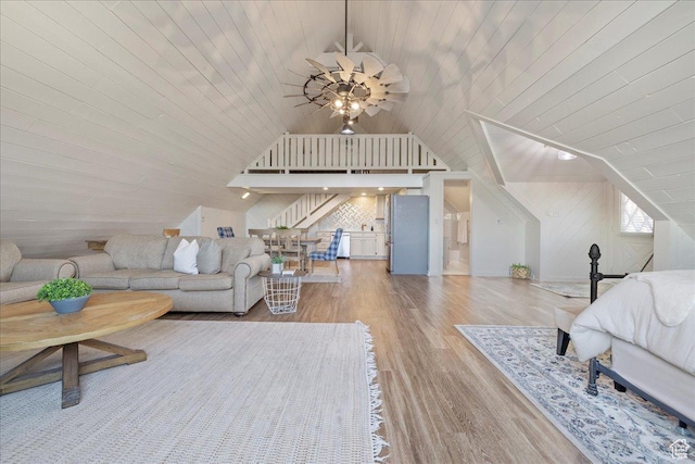 bedroom featuring lofted ceiling, wood ceiling, and wood finished floors