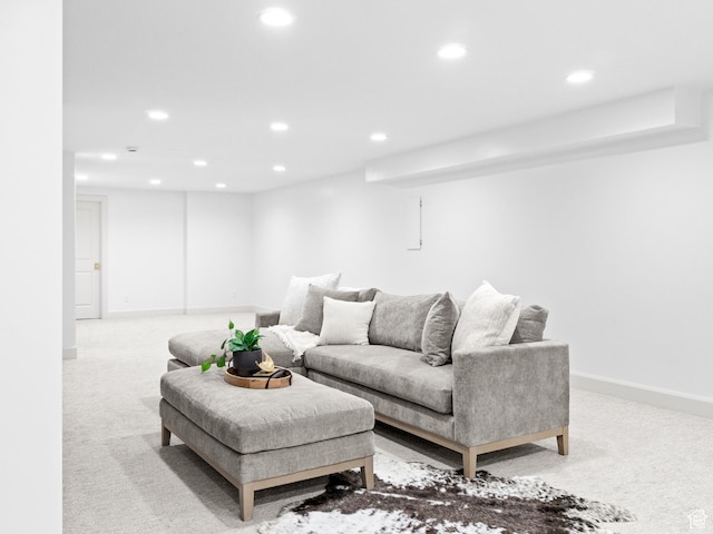 carpeted living room with recessed lighting and baseboards