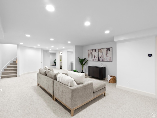 living area featuring recessed lighting, carpet, baseboards, and stairs