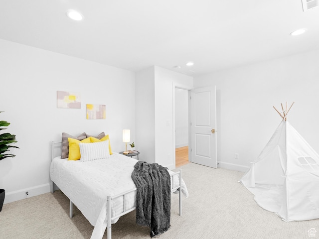 carpeted bedroom with recessed lighting and baseboards
