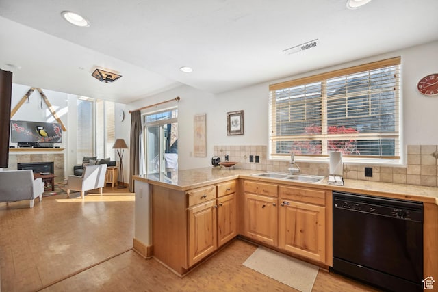 6042 N Fox Pointe Cir, Park City, UT 84098 - kitchen with black dishwasher, a sink, tile countertops, a fireplace, and a peninsula