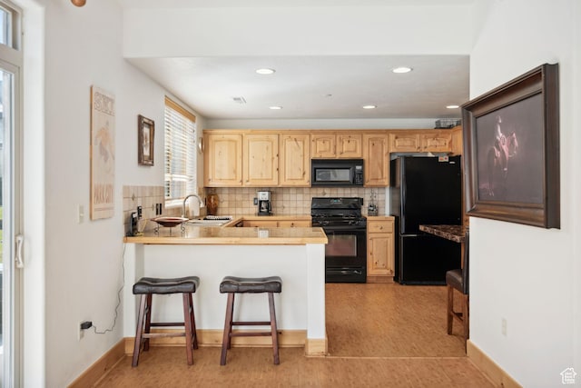 6042 N Fox Pointe Cir, Park City, UT 84098 - kitchen featuring black appliances, a sink, a peninsula, light brown cabinets, and decorative backsplash
