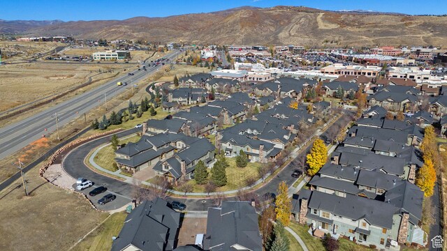 6042 N Fox Pointe Cir, Park City, UT 84098 - aerial overview of property's location featuring a mountainous background and nearby suburban area