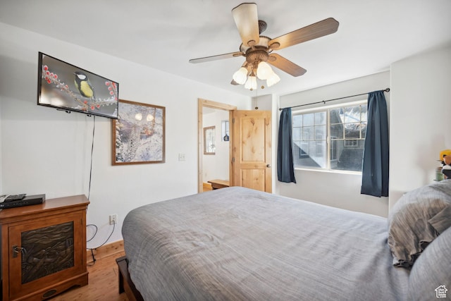 6042 N Fox Pointe Cir, Park City, UT 84098 - bedroom with wood finished floors and a ceiling fan