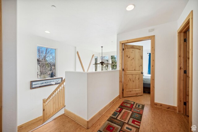 6042 N Fox Pointe Cir, Park City, UT 84098 - hall with an upstairs landing, light wood-style flooring, baseboards, healthy amount of natural light, and recessed lighting