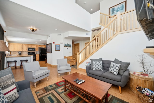 6042 N Fox Pointe Cir, Park City, UT 84098 - living room with stairs, recessed lighting, a towering ceiling, and light wood finished floors