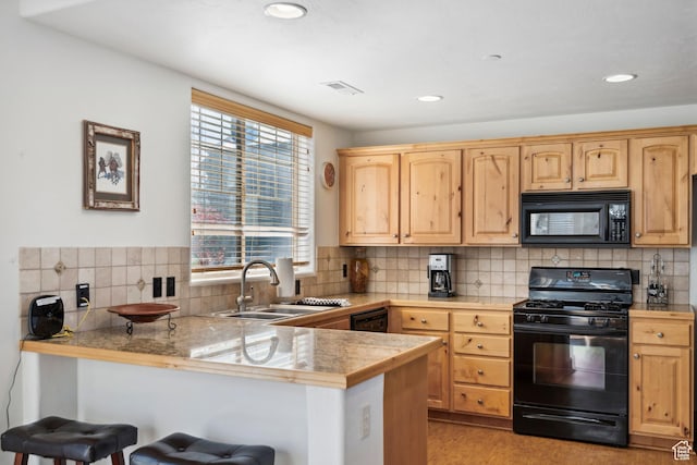 6042 N Fox Pointe Cir, Park City, UT 84098 - kitchen featuring black appliances, a sink, a peninsula, light brown cabinetry, and recessed lighting