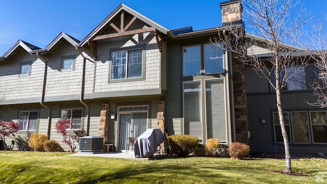 6042 N Fox Pointe Cir, Park City, UT 84098 - rear view of property featuring central AC unit, a yard, and a chimney