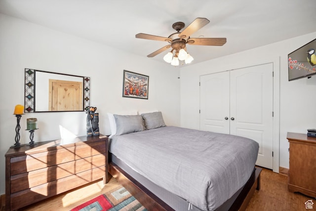 6042 N Fox Pointe Cir, Park City, UT 84098 - bedroom with wood finished floors, a closet, and a ceiling fan