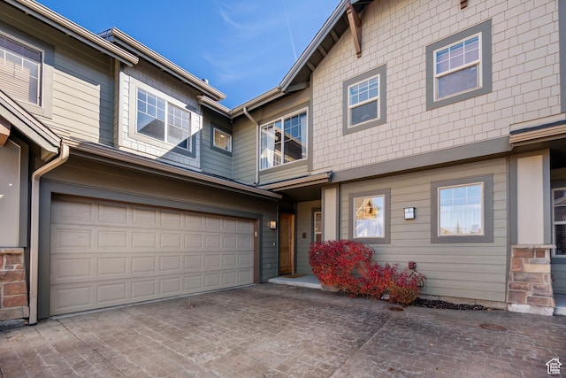 6042 N Fox Pointe Cir, Park City, UT 84098 - view of property featuring an attached garage and driveway