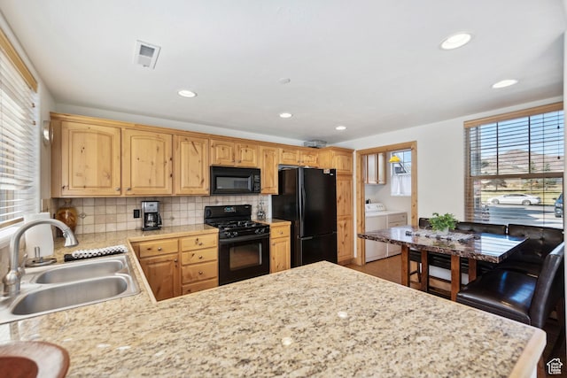 6042 N Fox Pointe Cir, Park City, UT 84098 - kitchen featuring black appliances, a sink, separate washer and dryer, light countertops, and recessed lighting