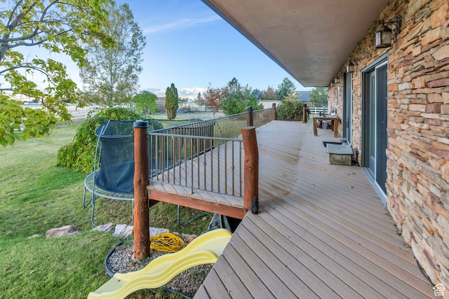 1122 Ironwood Rd, Erda, UT 84074 - deck with a lawn and a trampoline