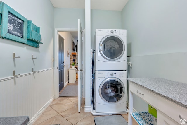 1122 Ironwood Rd, Erda, UT 84074 - washroom with stacked washer / dryer and light tile patterned floors