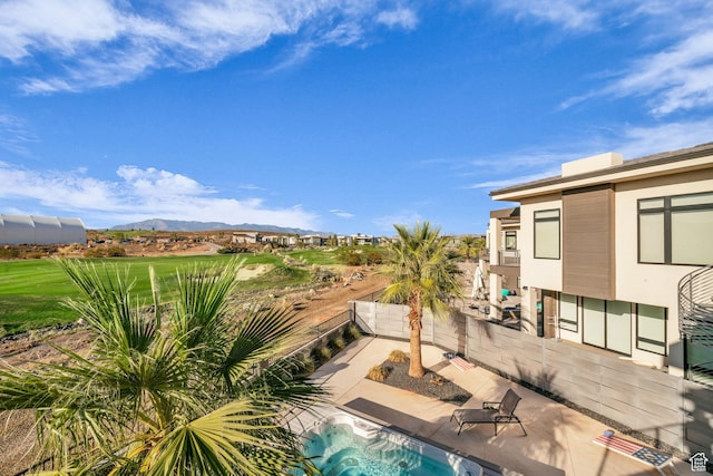 1498 W Torrey Pines Rd, Hurricane, UT 84737 - view of pool featuring a mountain view, a patio, an outdoor hot tub, and fence