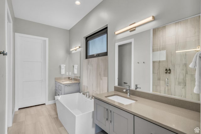 1498 W Torrey Pines Rd, Hurricane, UT 84737 - full bathroom with a stall shower, a freestanding bath, two vanities, and recessed lighting