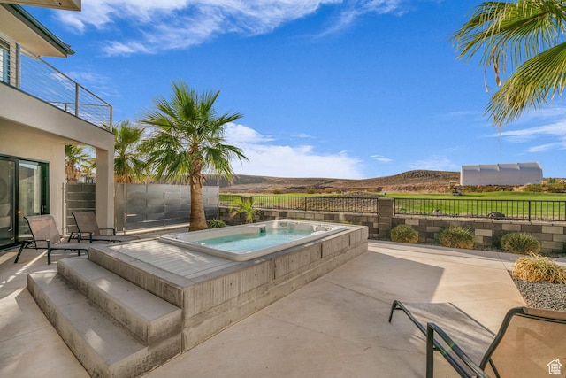 1498 W Torrey Pines Rd, Hurricane, UT 84737 - view of swimming pool with an in-ground hot tub, a fenced backyard, and a patio area